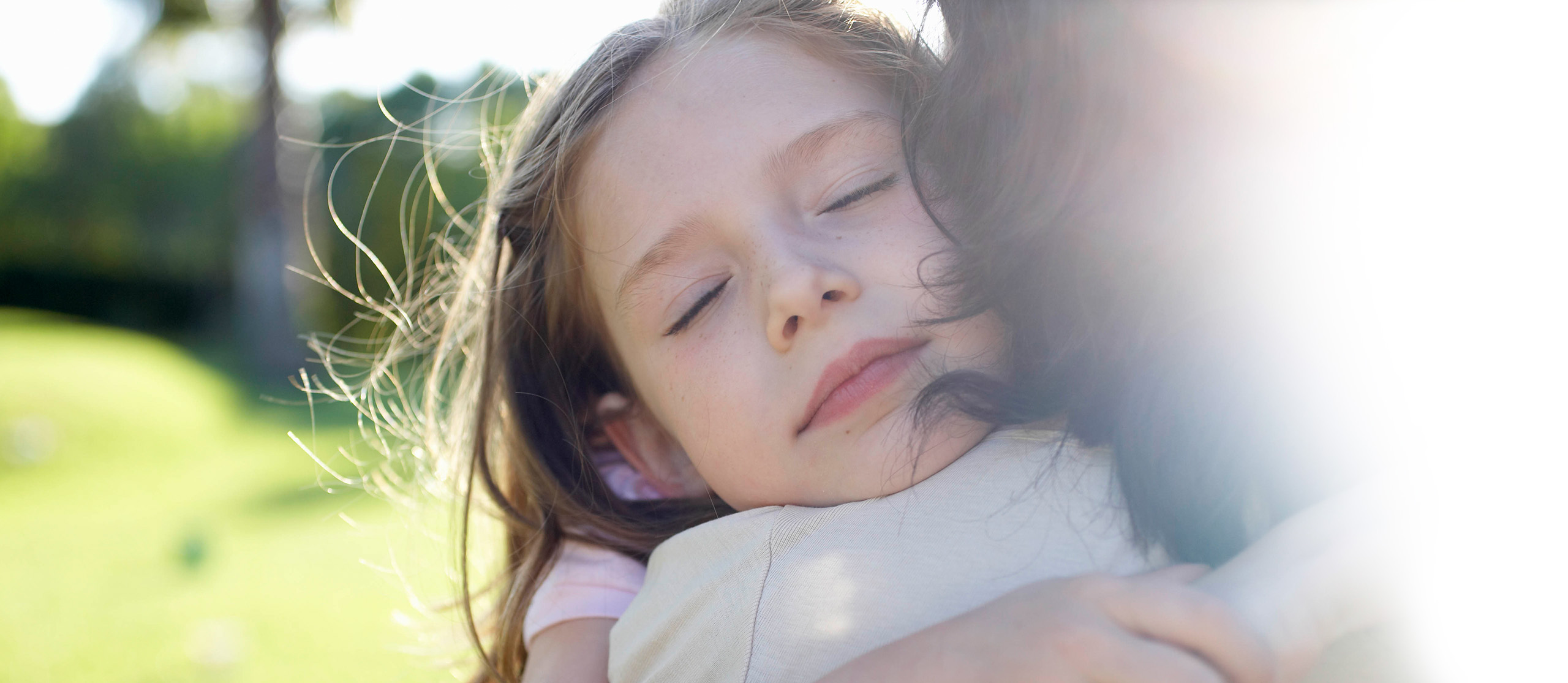 Young girl hugging her mother