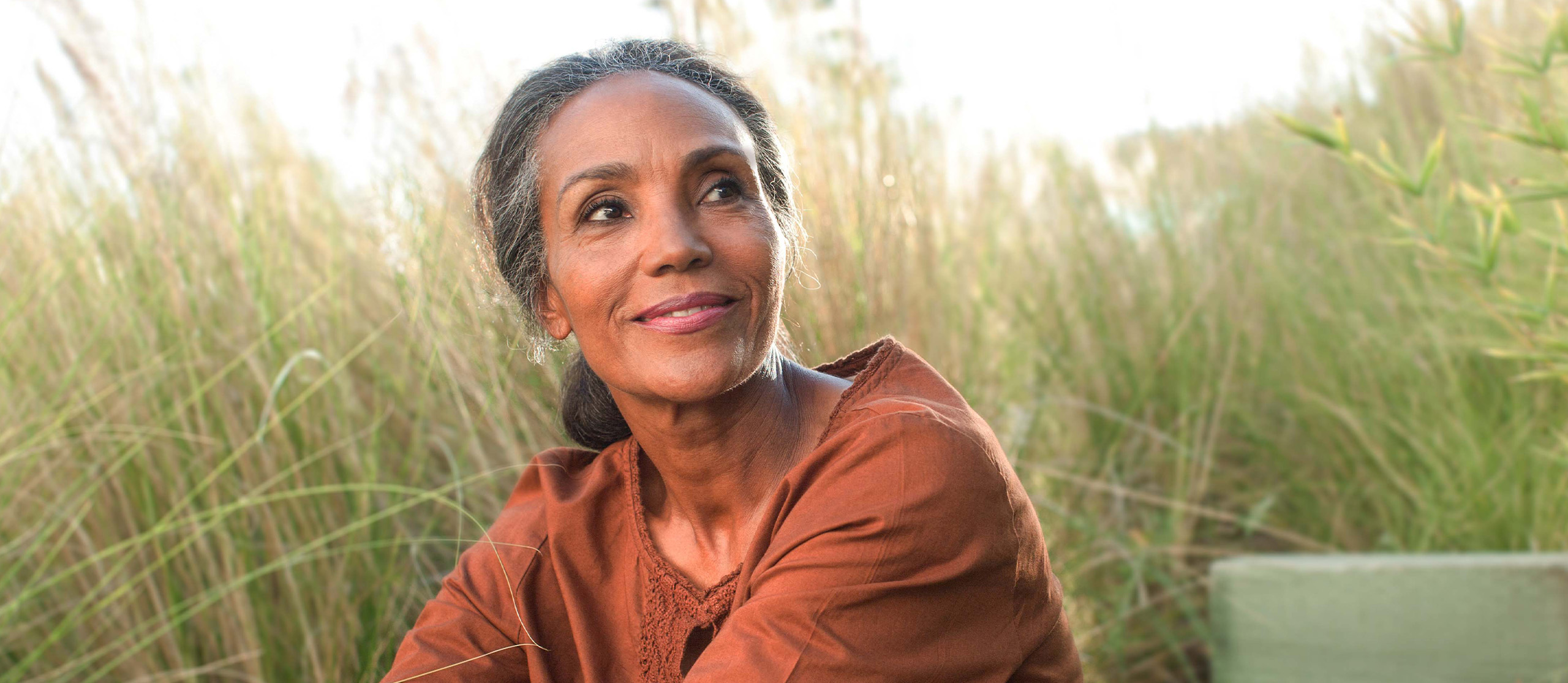 Lovely middle aged woman in tall grass