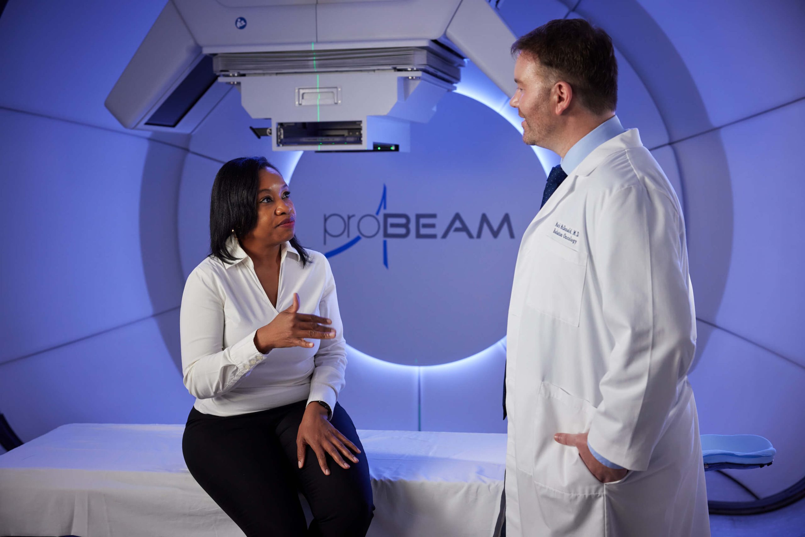 Doctor and patient talking in gantry