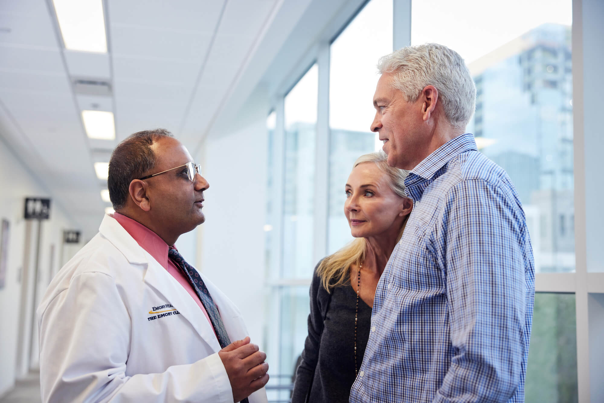 Doctor talking to couple